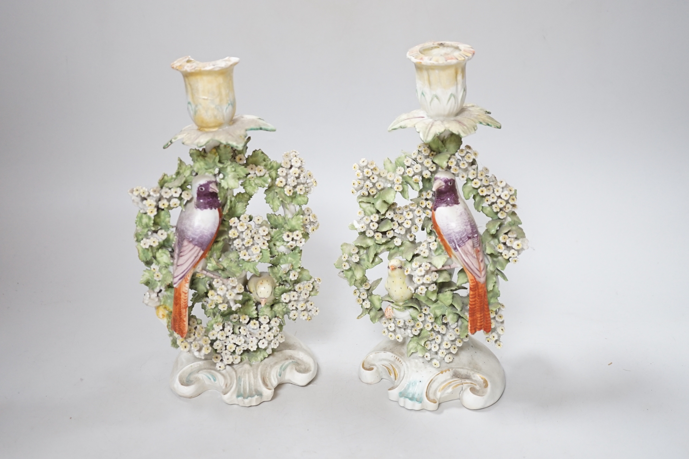 A pair of Derby ‘bird’ candlesticks, c.1760-5, 28cm